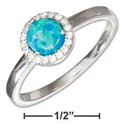 Sterling silver synthetic blue opal ring with micro pave cubic zirconia halo